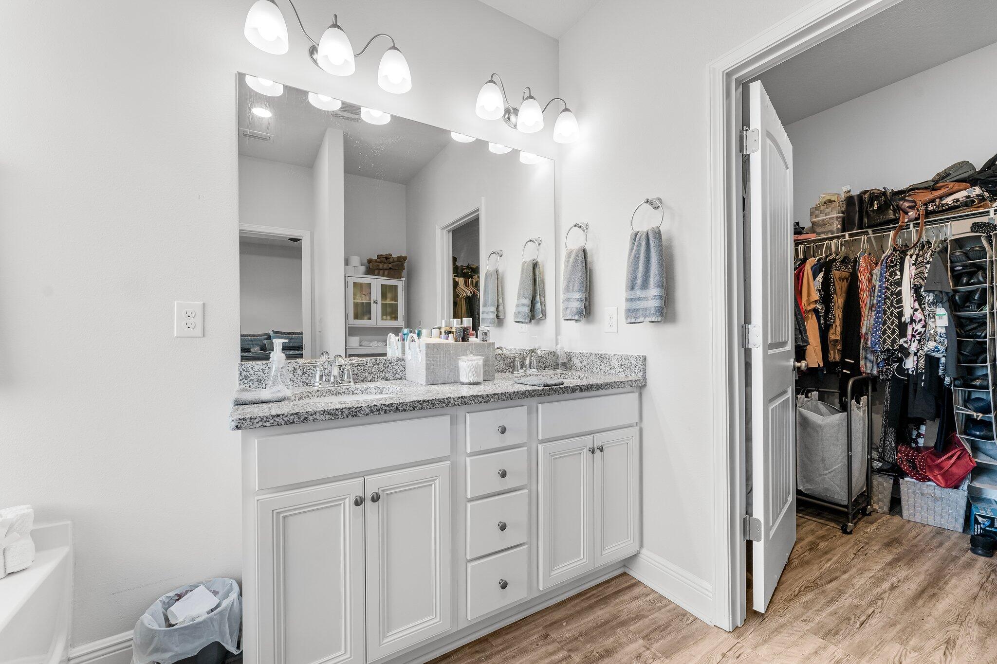 813 Cason Circle Panama City, FL 32405 - Photo 9 of 20 a bathroom with a granite countertop sink a toilet and a mirror