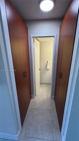 a view of a hallway and closet