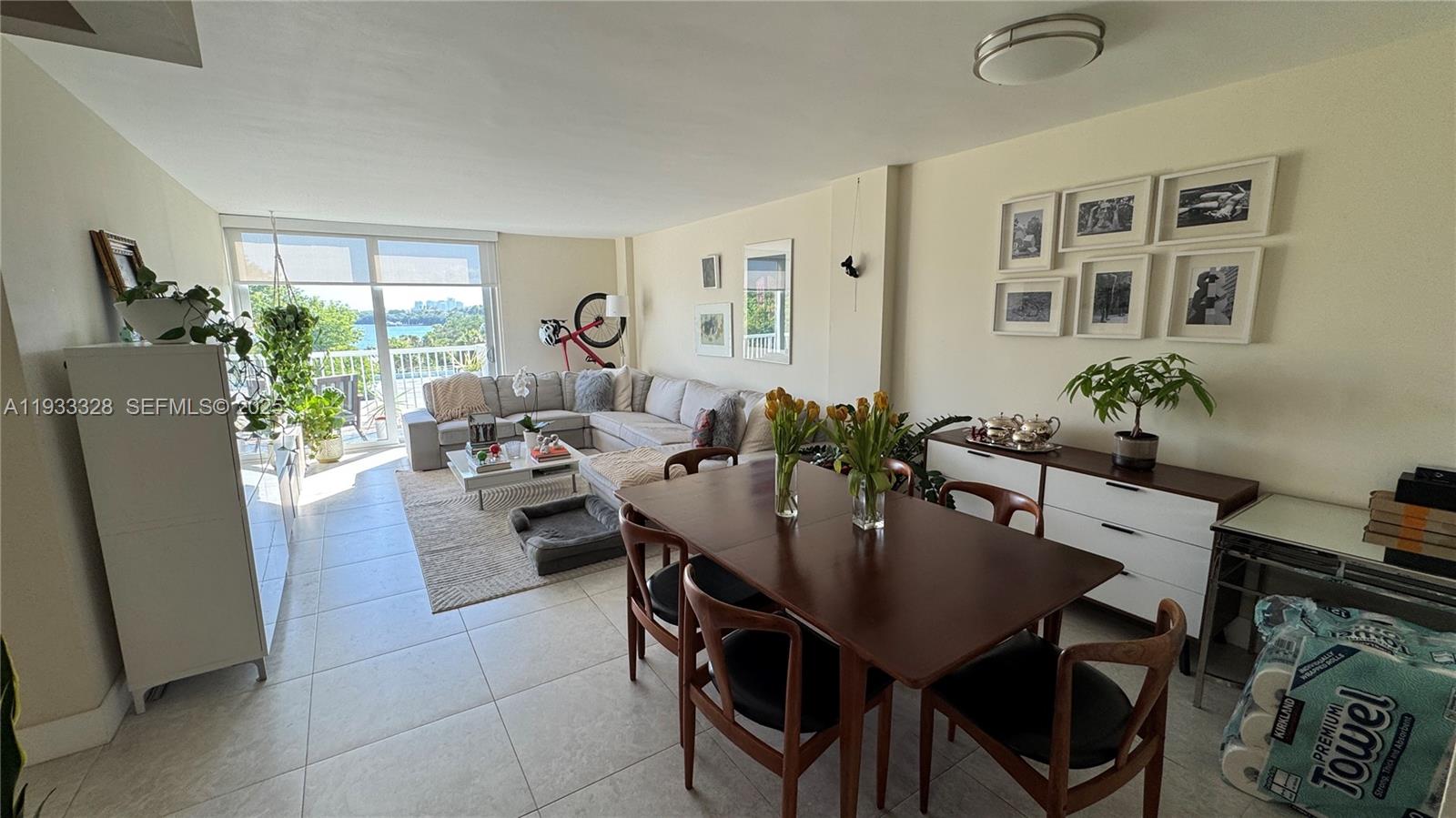 150 Southeast 25th Road, Unit 5L Miami, FL 33129 - Photo 5 of 9 a view of a dining room with furniture and a potted plant