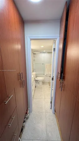 a view of a bathroom from a hallway