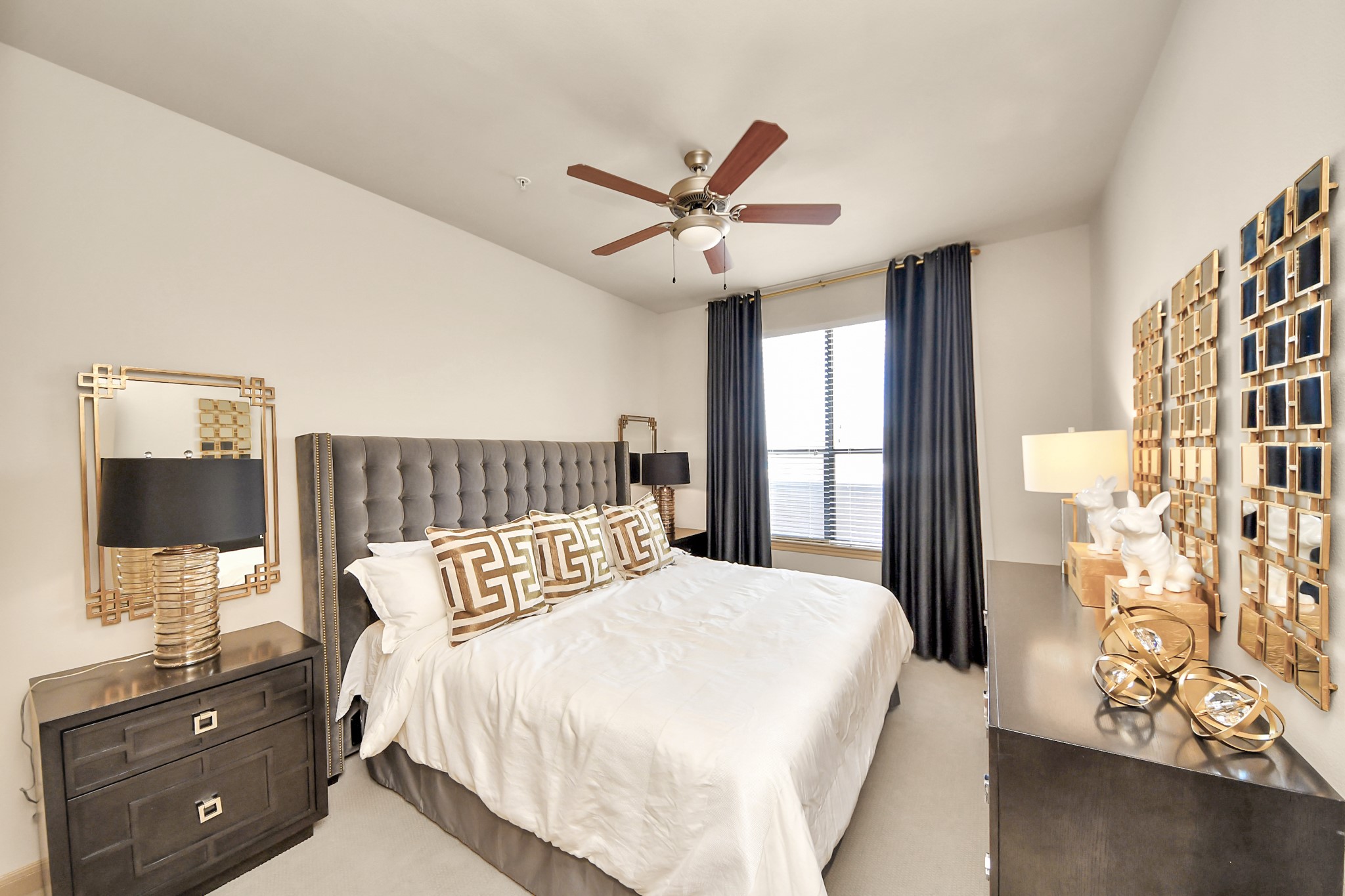 6363 San Felipe Street, Unit 314 Houston, TX 77057 - Photo 15 of 43 a bedroom with a large bed and a flat tv screen on dresser