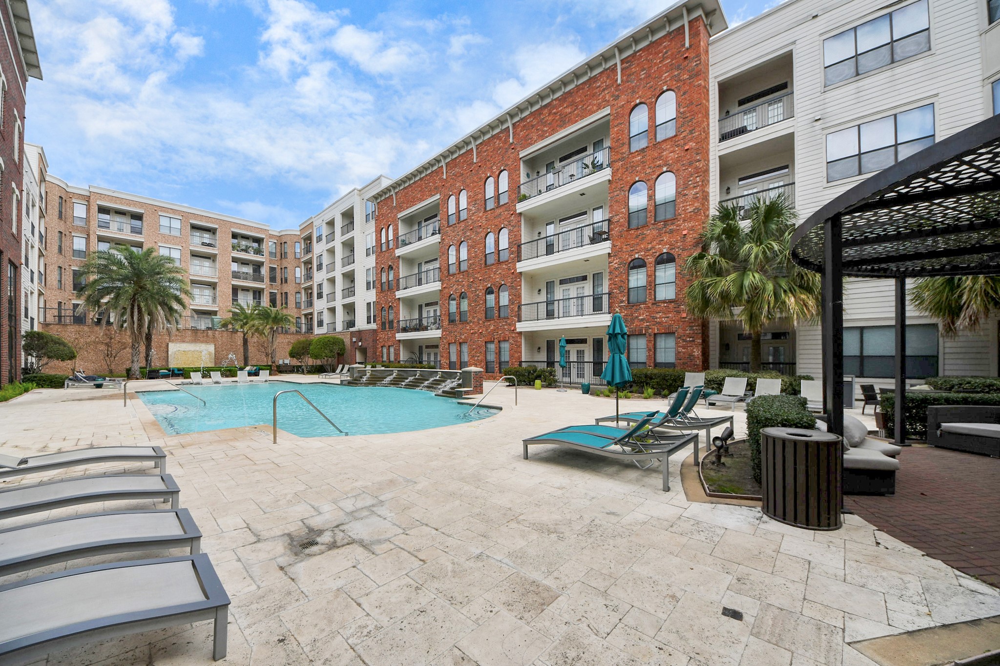 6363 San Felipe Street, Unit 314 Houston, TX 77057 - Photo 37 of 43 a row of palm trees in front of a building