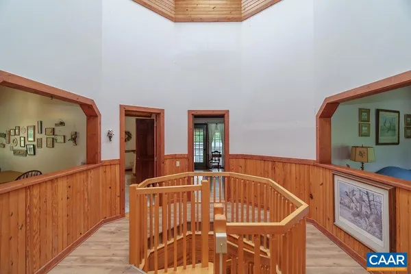 a bedroom with a bed and a mirror