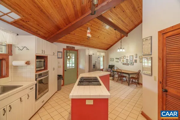 a very nice looking kitchen with a large window