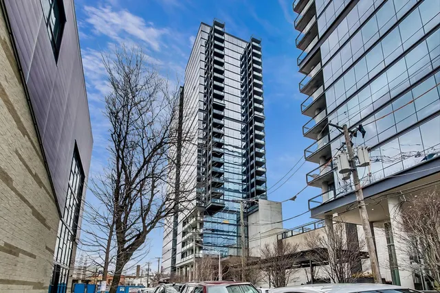 a front view of a building with a yard