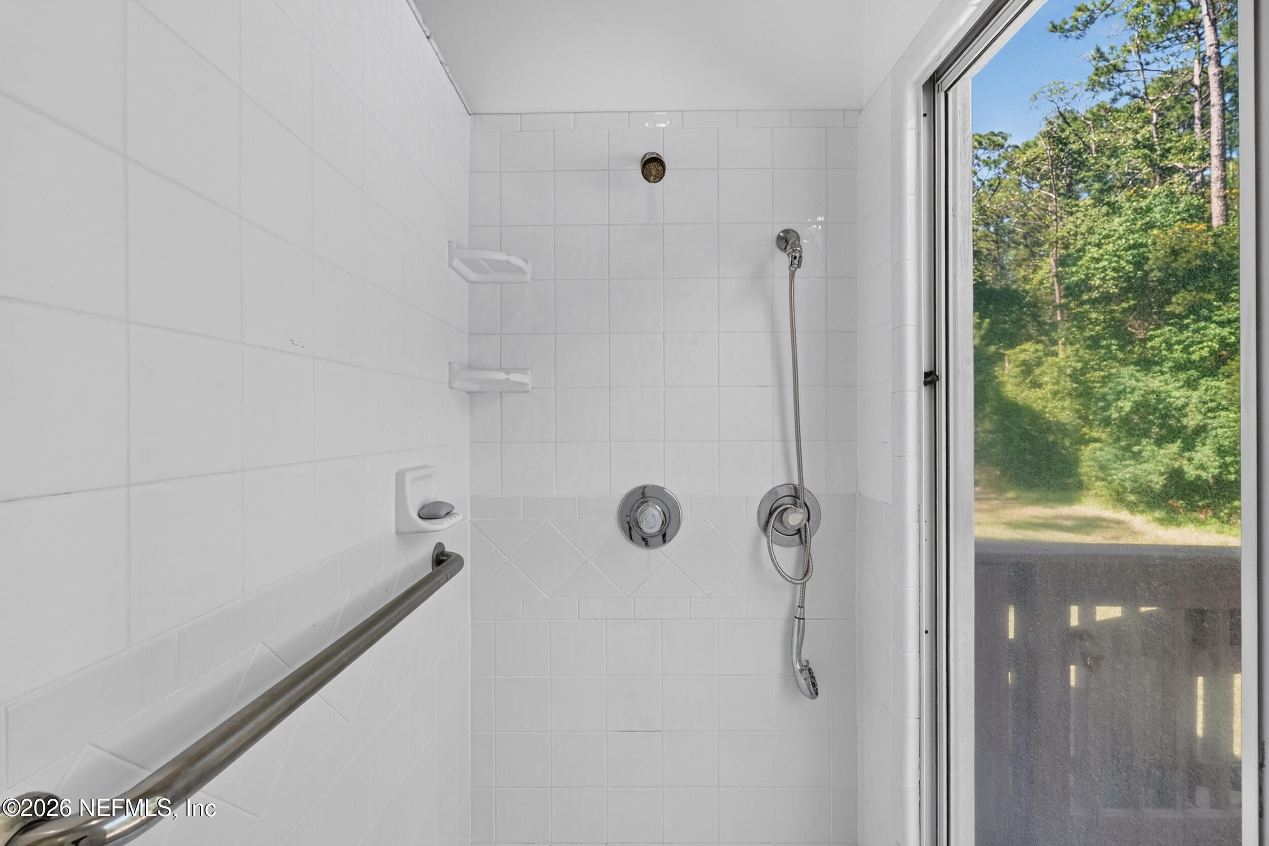 3090 Monument Bay Road St. Augustine, FL 32092 - Photo 30 of 56 a bathroom with a shower