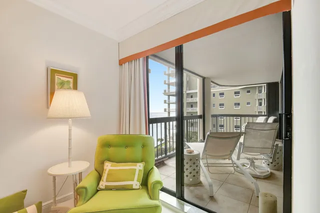 a living room with furniture and a lamp