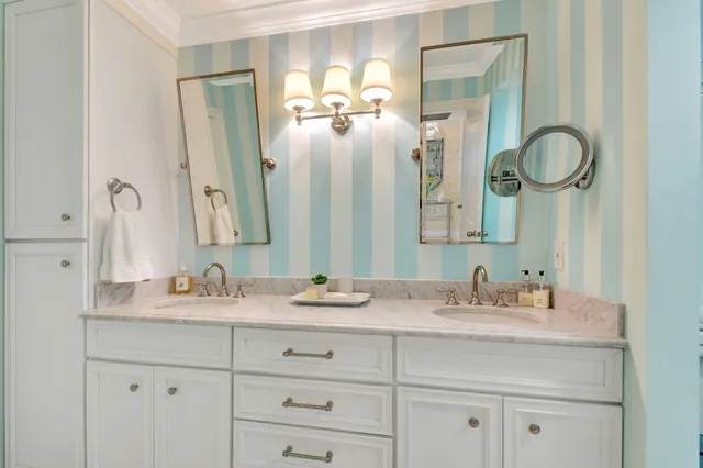 a bathroom with a double vanity sink and a mirror