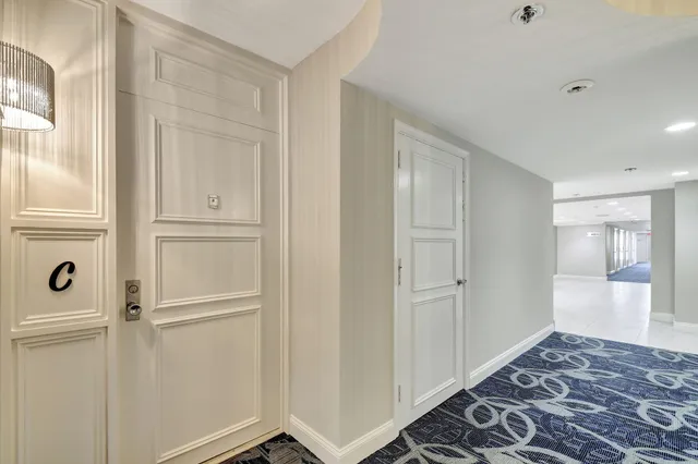 a view of a bedroom with wooden floor