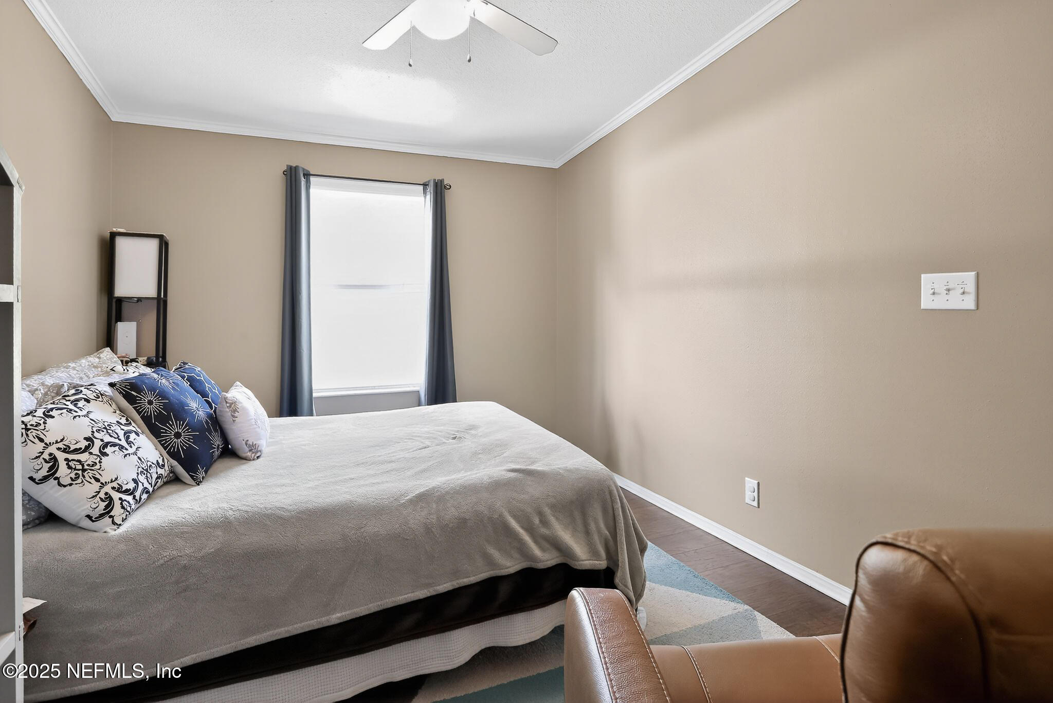 4824 Gadara Road Keystone Heights, FL 32656 - Photo 12 of 14 a bedroom with a bed and a chair