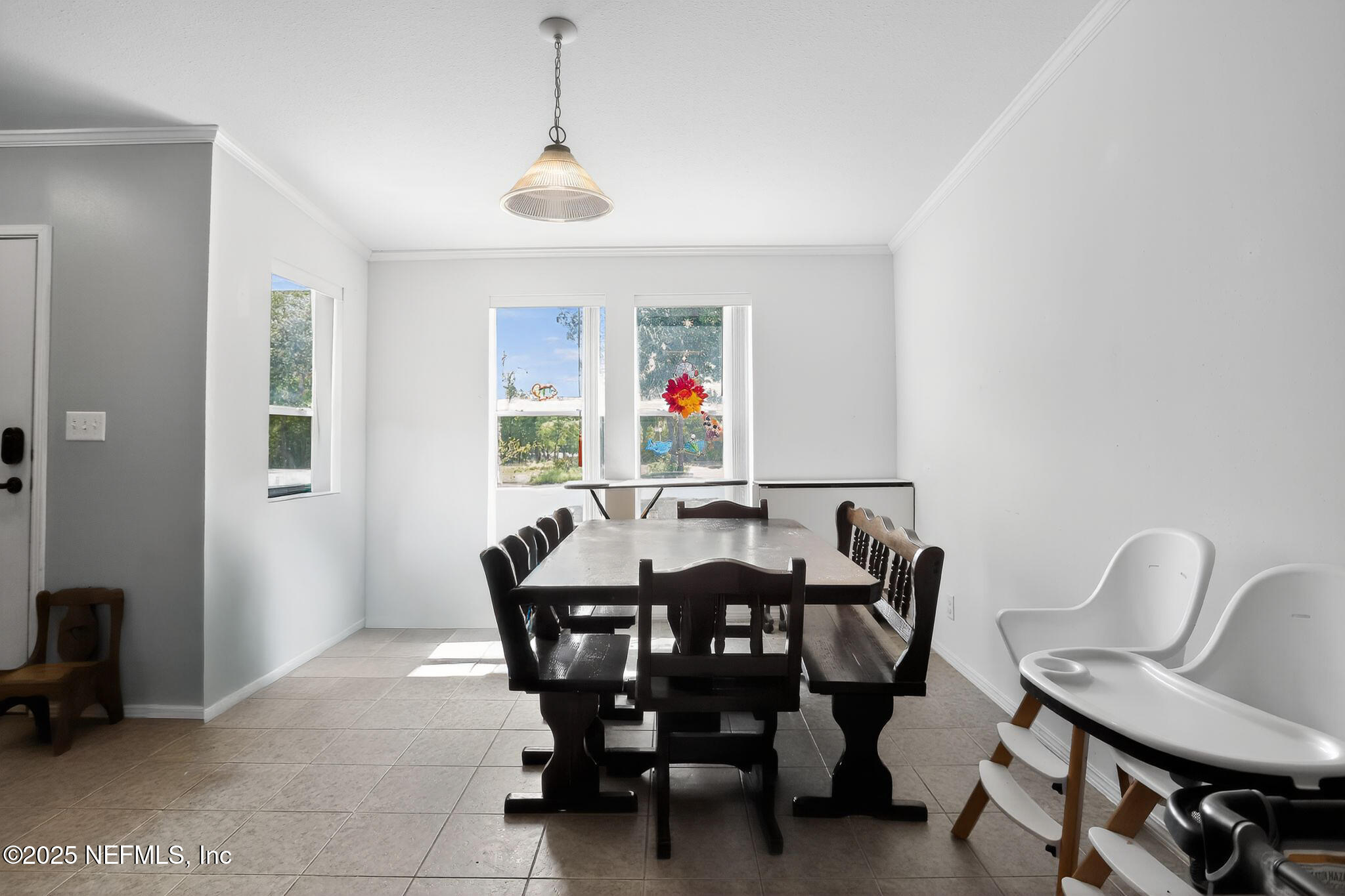 4824 Gadara Road Keystone Heights, FL 32656 - Photo 14 of 14 a view of a dining room with furniture and a chandelier