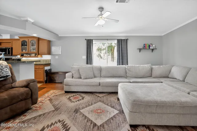 a living room with furniture and a window