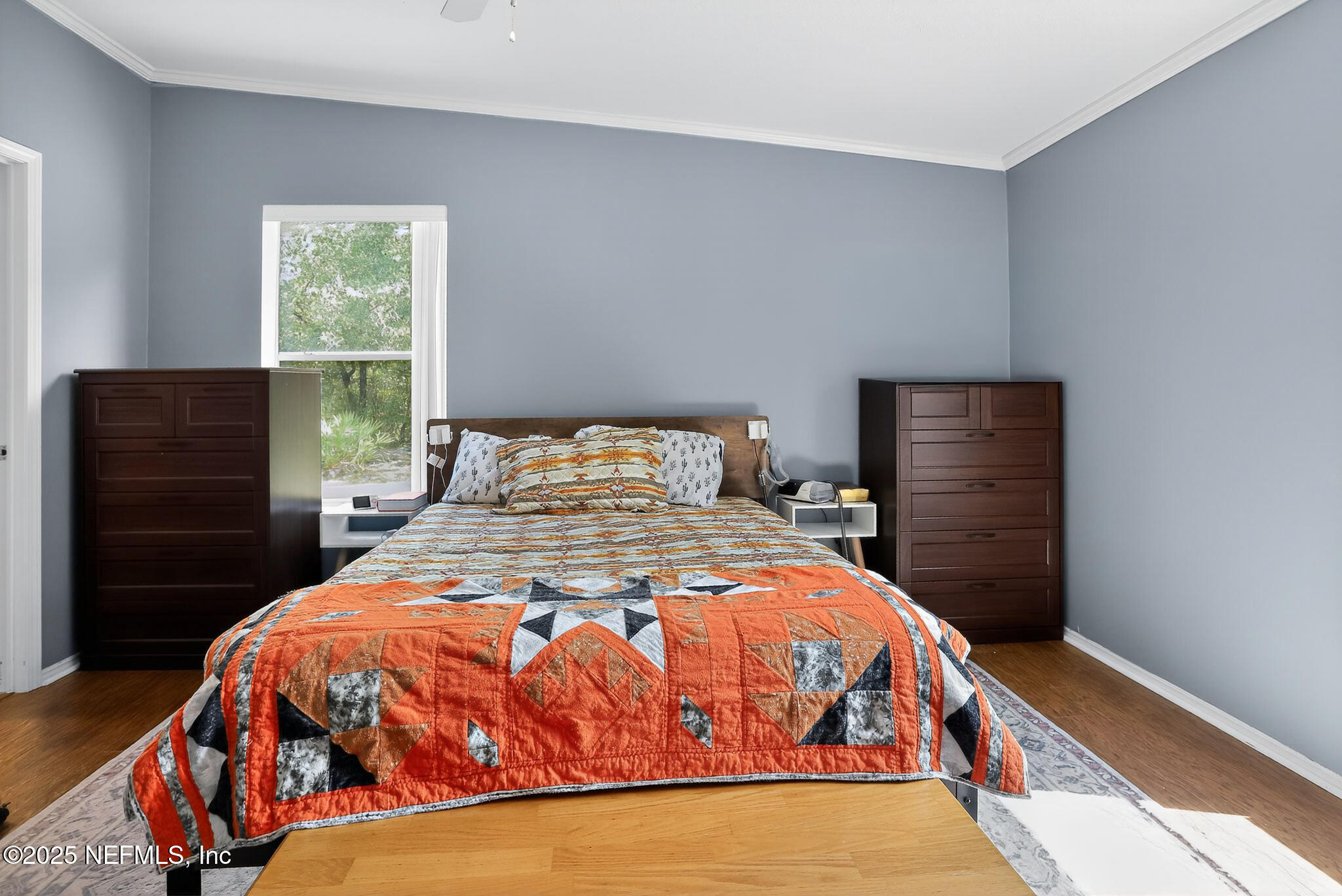 4824 Gadara Road Keystone Heights, FL 32656 - Photo 8 of 14 a bedroom with a bed and wooden floor