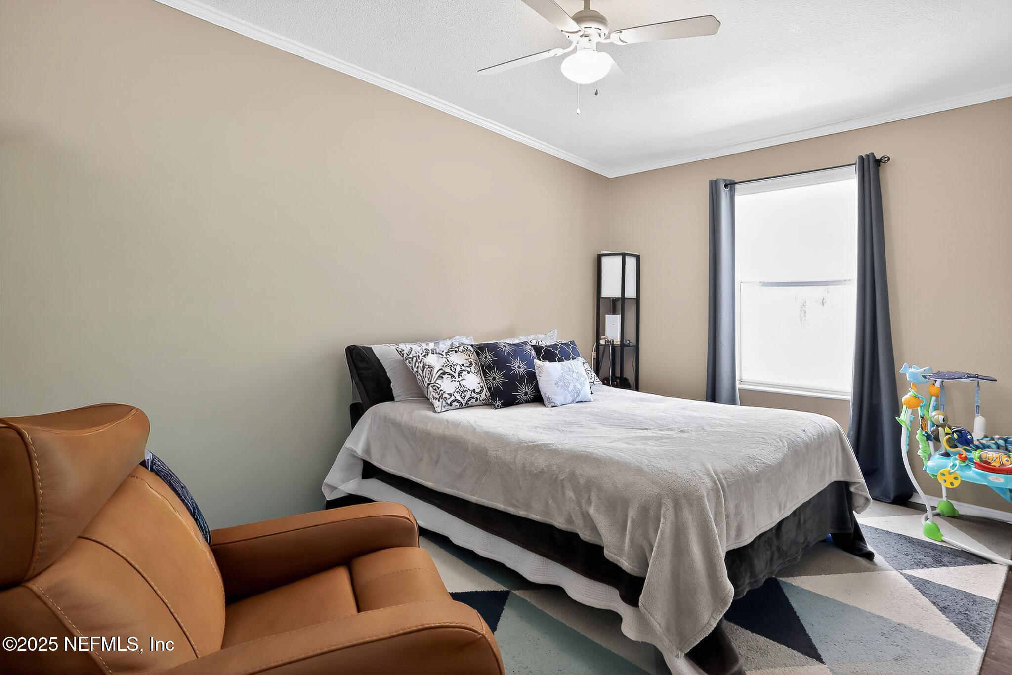 4824 Gadara Road Keystone Heights, FL 32656 - Photo 10 of 14 a bedroom with a bed couch and a window