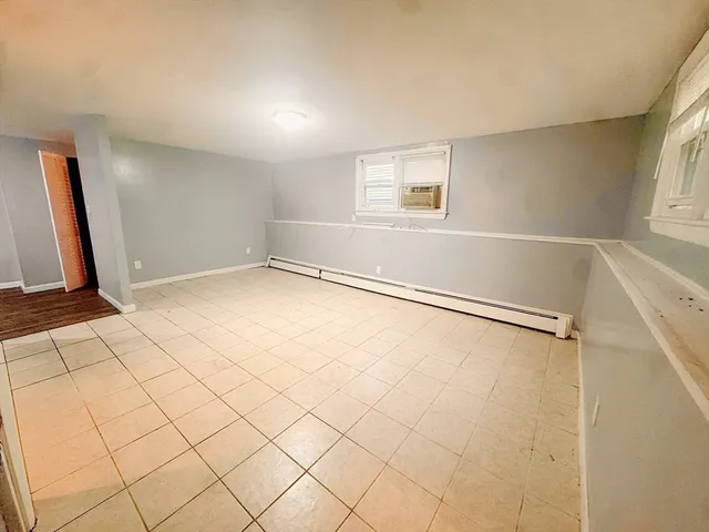 a view of an empty room with windows