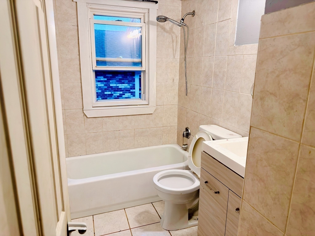 6 A Maynard Street, Unit A Boston, MA 02131 - Photo 6 of 12 a bathroom with a bathtub a toilet and a shower