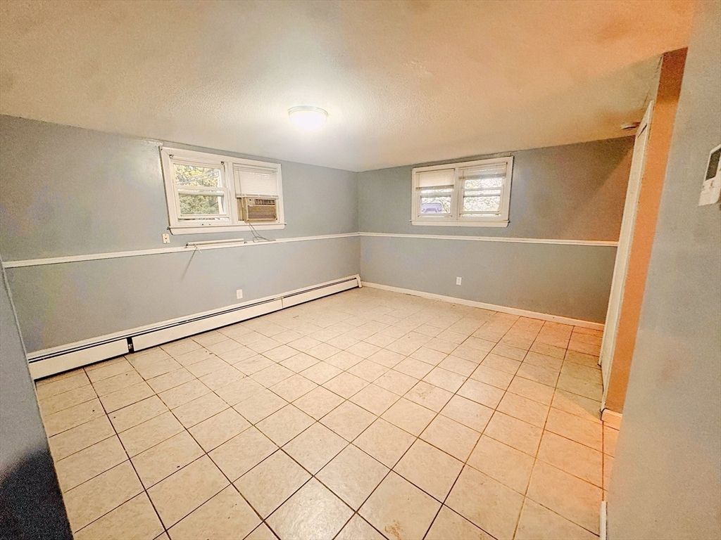 6 A Maynard Street, Unit A Boston, MA 02131 - Photo 10 of 12 a view of an empty room with windows
