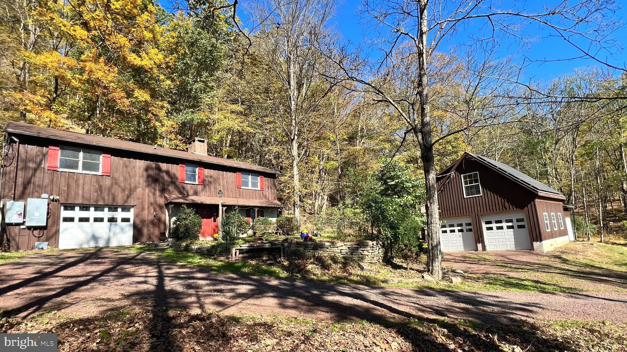 Front view of home and barn