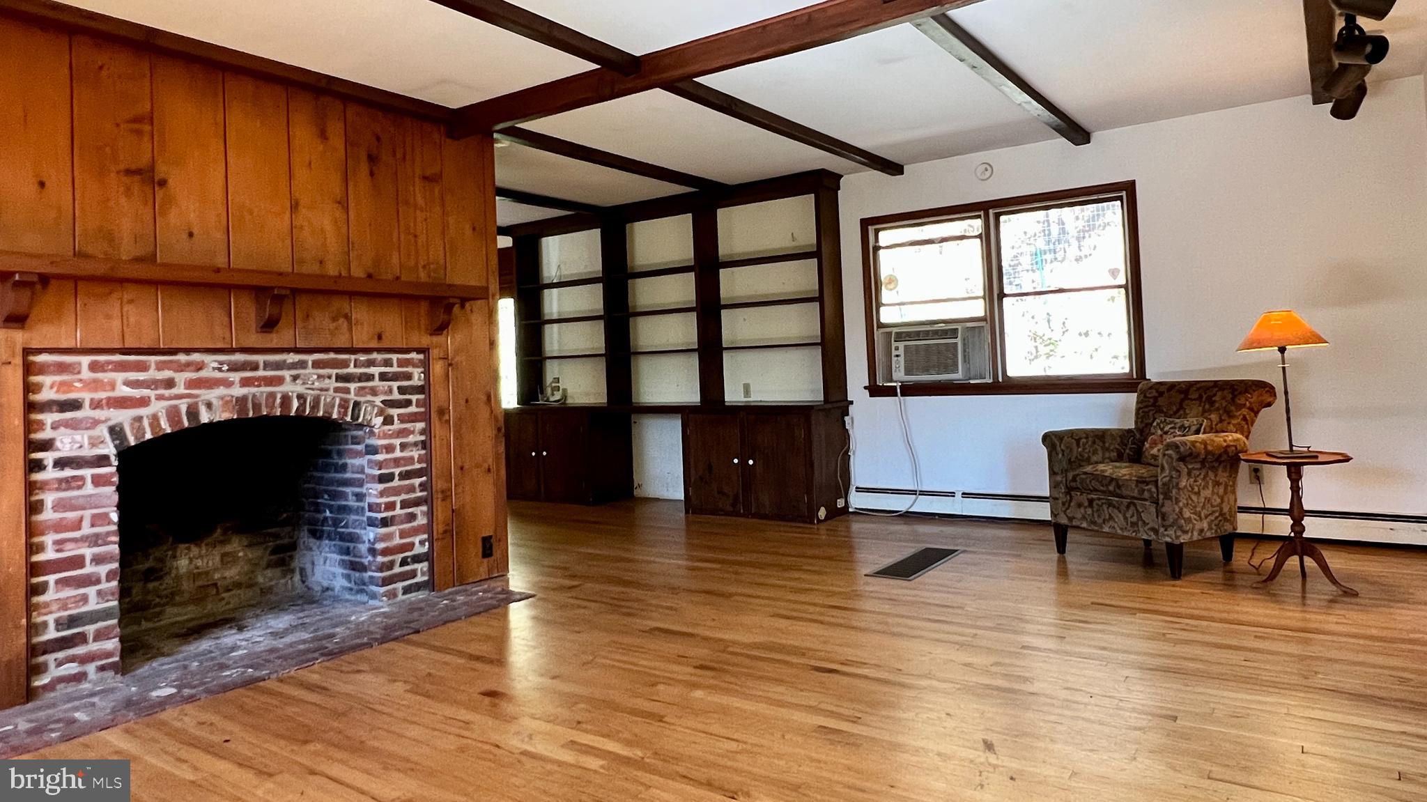 280 Headquarters Road Erwinna, PA 18920 - Photo 3 of 24 Built in shelving, wood flooring and exposed beams