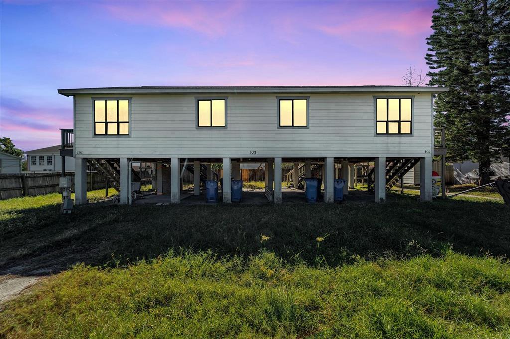 108 West Shell Point Road, Unit 101 Ruskin, FL 33570 - Photo 1 of 1 a front view of a house with a yard