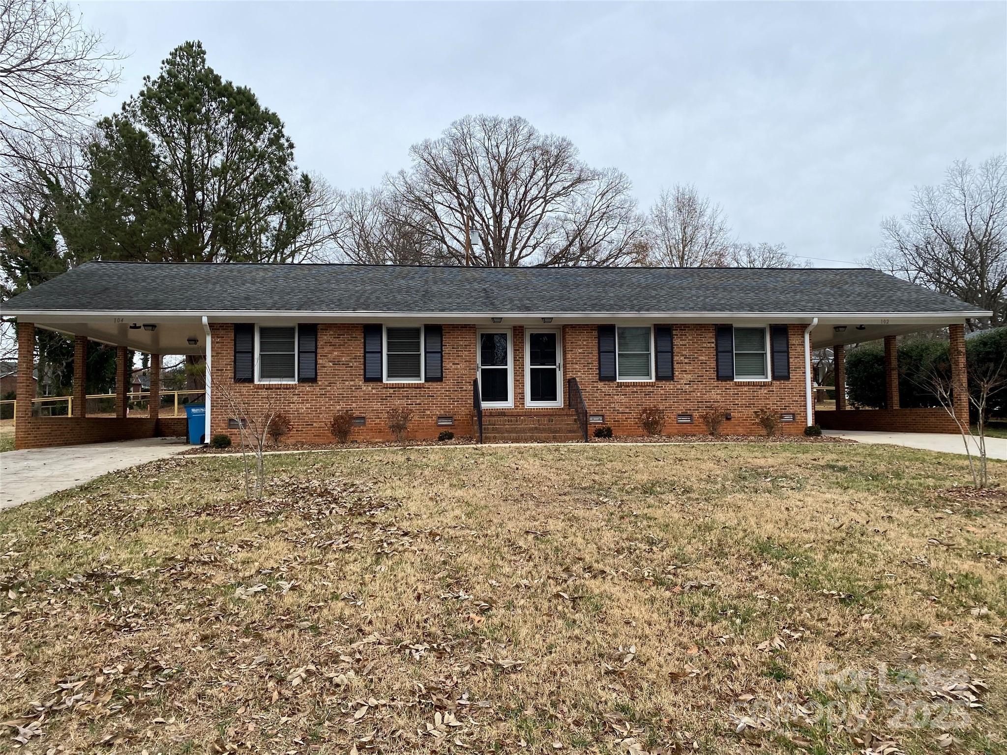 104 Secrest Avenue Belmont, NC 28012 - Photo 1 of 10 a front view of a house with a garden