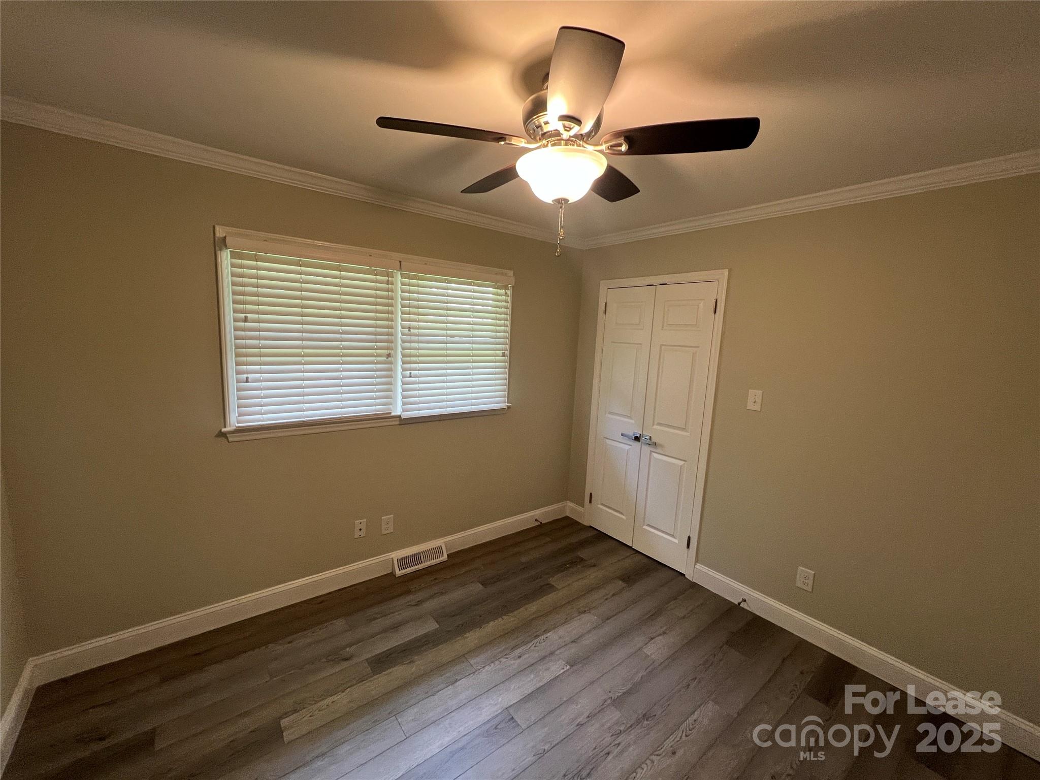 104 Secrest Avenue Belmont, NC 28012 - Photo 5 of 10 a view of a room with wooden floor and windows