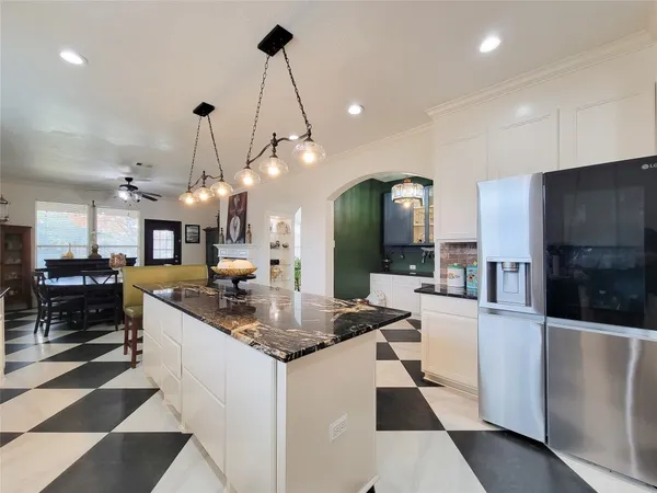 a view of a lake with houses in the background