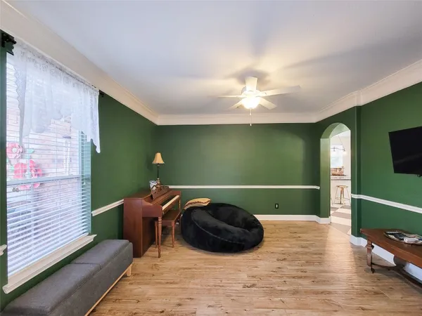 a living room with furniture flat screen tv and a fireplace