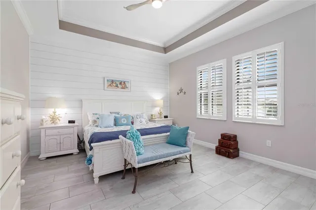 a dining room with table and flowerpot