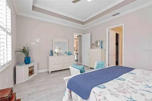 a bedroom with furniture and a window