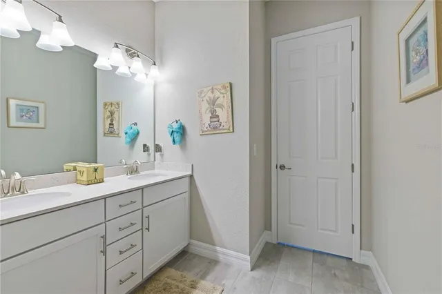 an aerial view of a house with a lake view