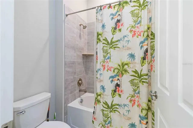 an aerial view of a houses with yard