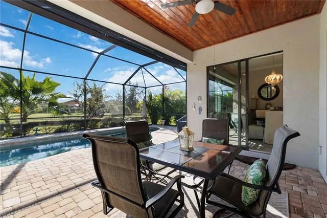 an aerial view of a house with a lake view