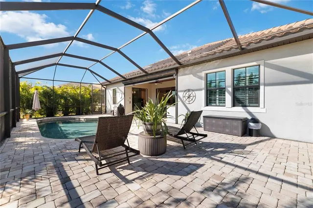 an aerial view of houses with outdoor space