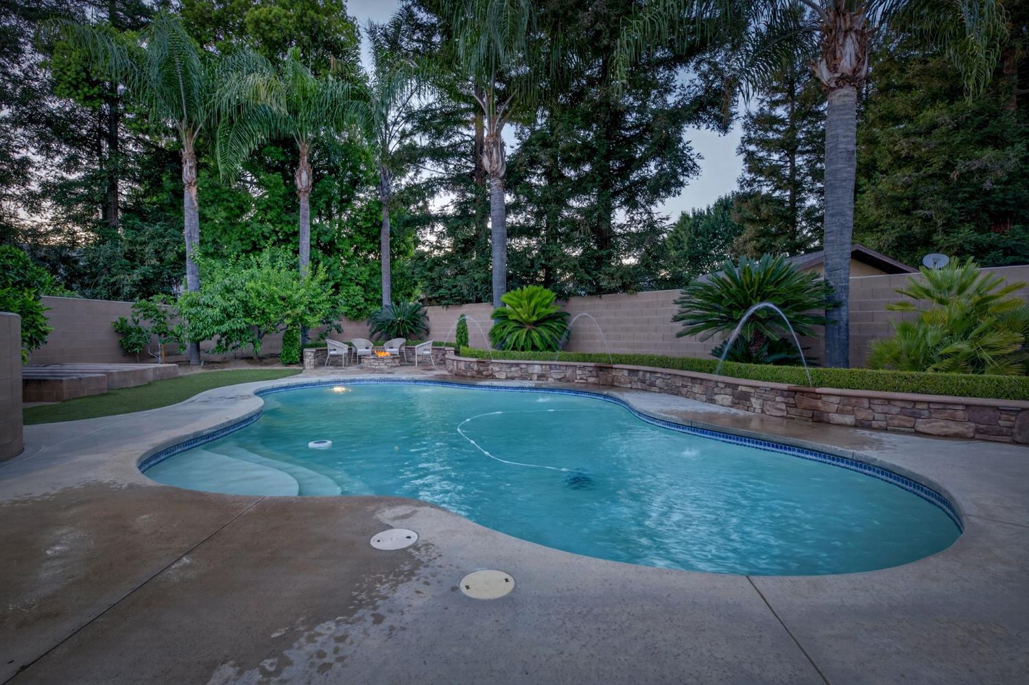 601 Decatur Avenue Clovis, CA 93611 - Photo 40 of 62 a view of a swimming pool with a sitting space