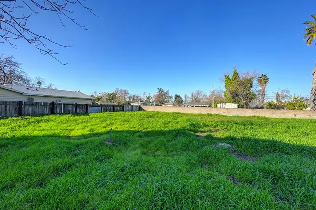 a view of a house with a yard porch and sitting area