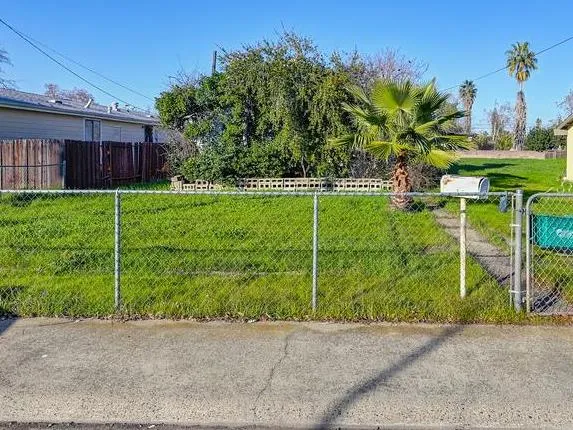 a view of a big yard with an outdoor space and seating