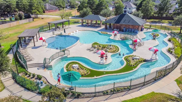a view of a swimming pool with a patio
