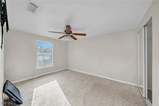 a view of empty room with windows