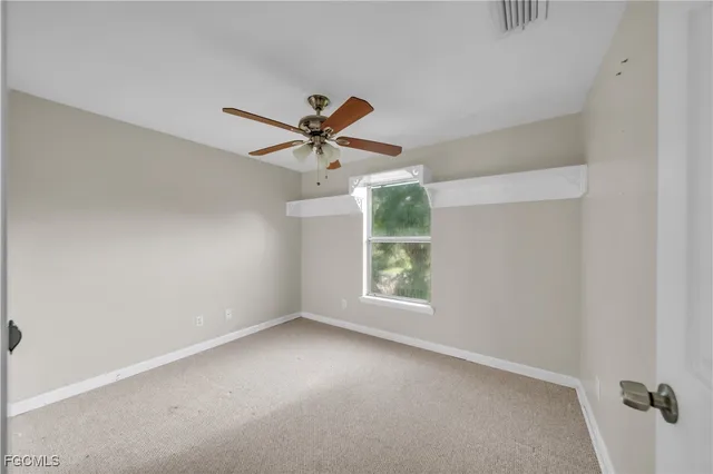 a view of an empty room and window