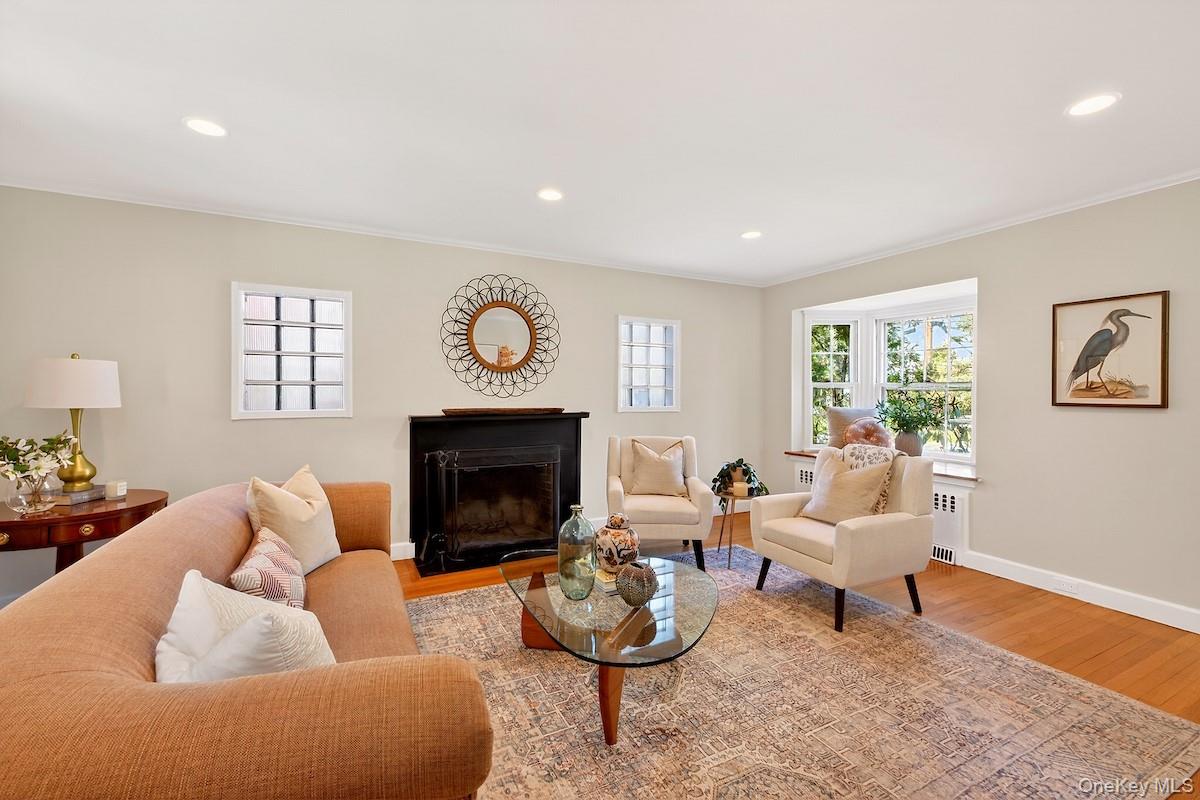48 Fenwick Road Hastings-on-Hudson, NY 10706 - Photo 12 of 40 a living room with furniture and a fireplace