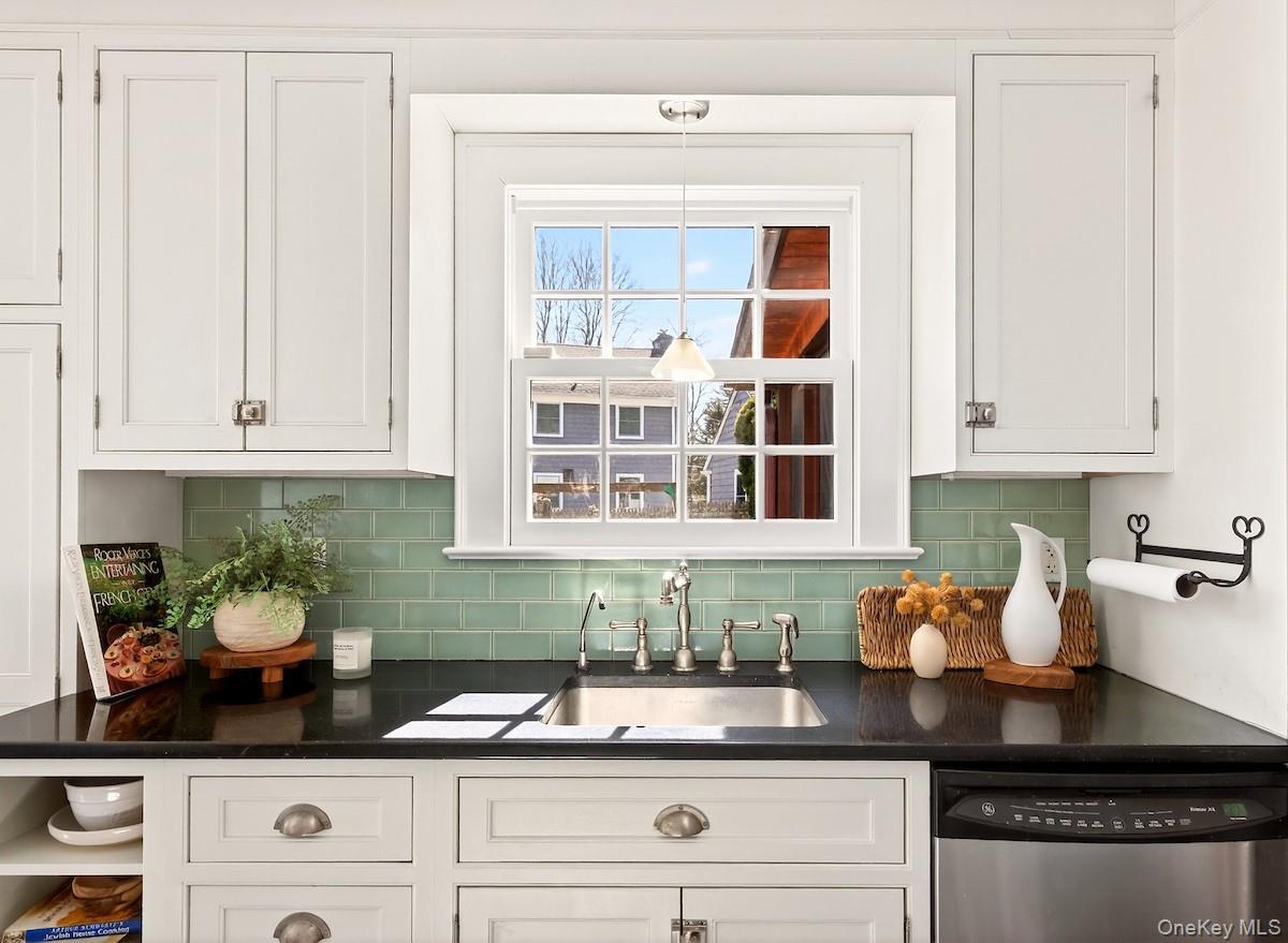 48 Fenwick Road Hastings-on-Hudson, NY 10706 - Photo 16 of 40 a kitchen with granite countertop white cabinets and white appliances