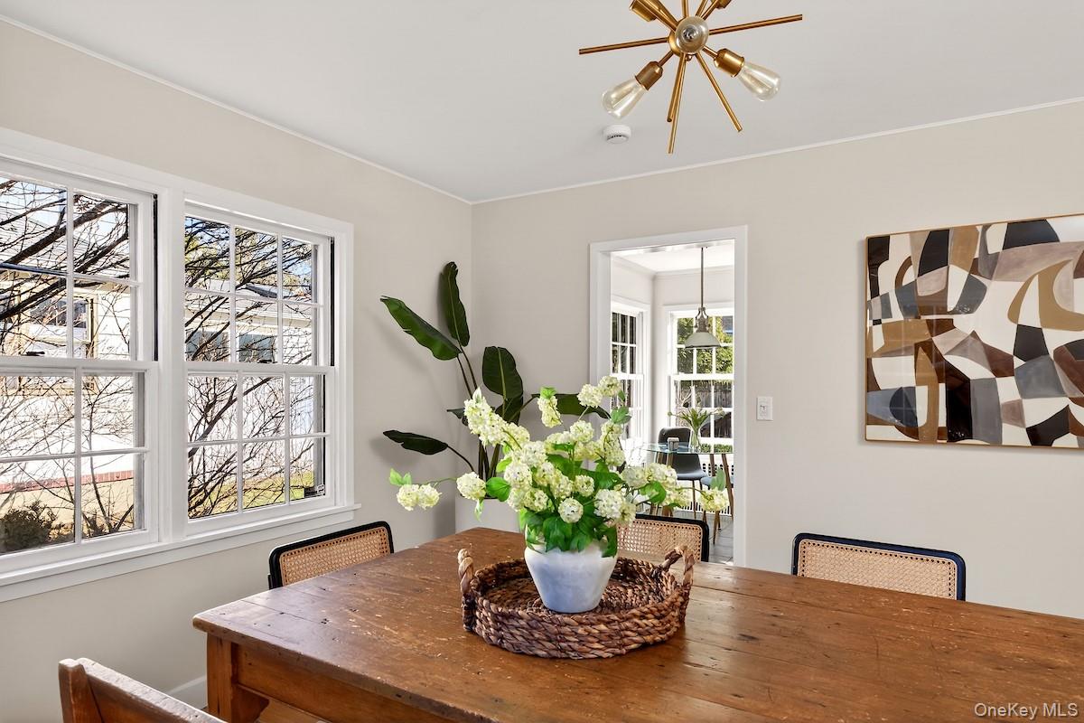 48 Fenwick Road Hastings-on-Hudson, NY 10706 - Photo 18 of 40 a view of a dining room with furniture and a potted plant
