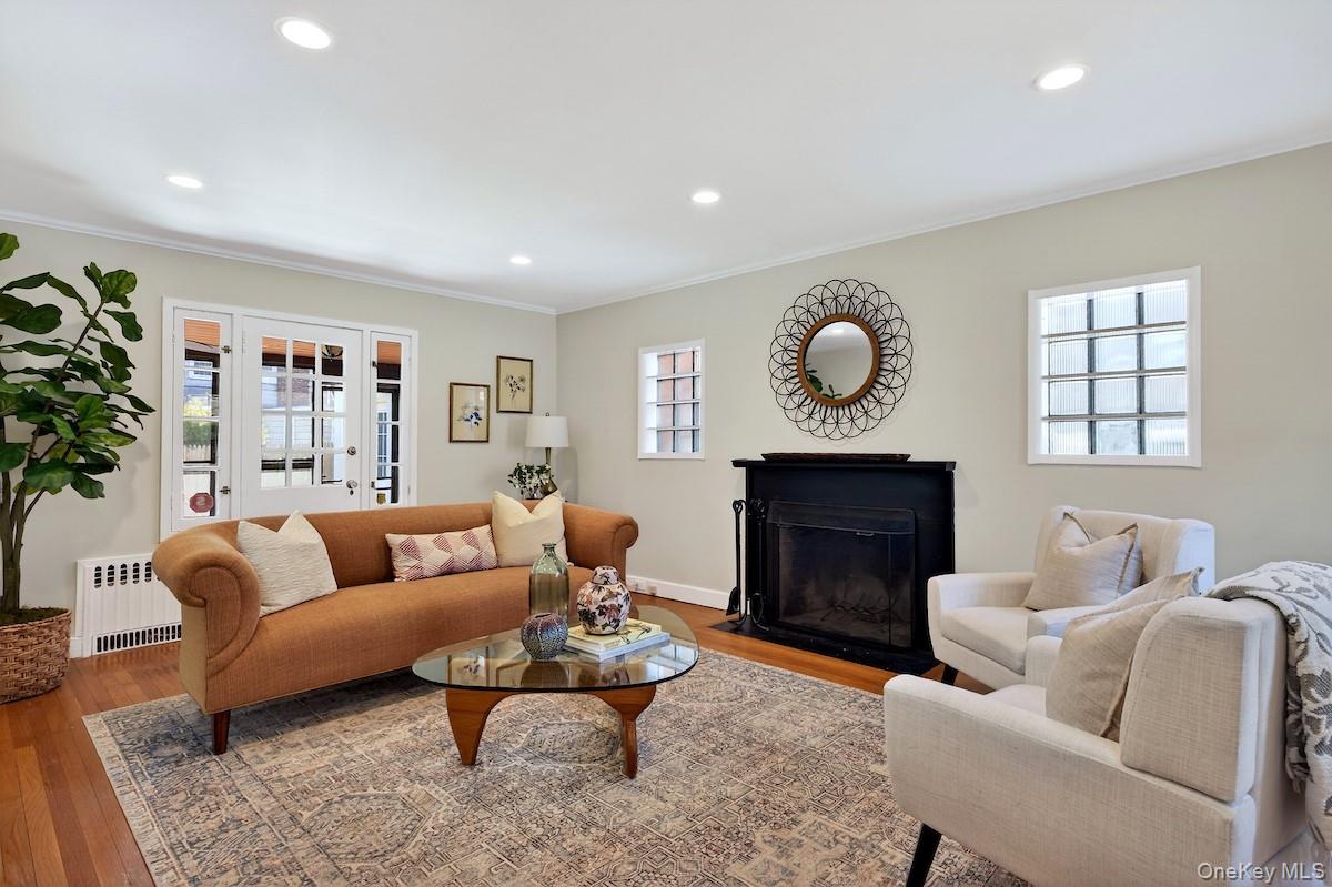 48 Fenwick Road Hastings-on-Hudson, NY 10706 - Photo 2 of 40 a living room with furniture potted plant and a fireplace