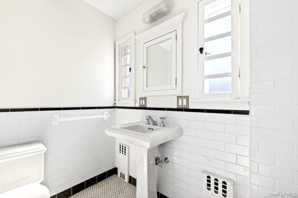 48 Fenwick Road Hastings-on-Hudson, NY 10706 - Photo 23 of 40 a bathroom with a sink and a mirror