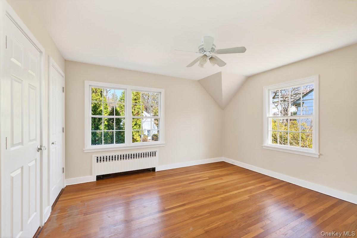 48 Fenwick Road Hastings-on-Hudson, NY 10706 - Photo 25 of 40 a view of an empty room with a window and wooden floor