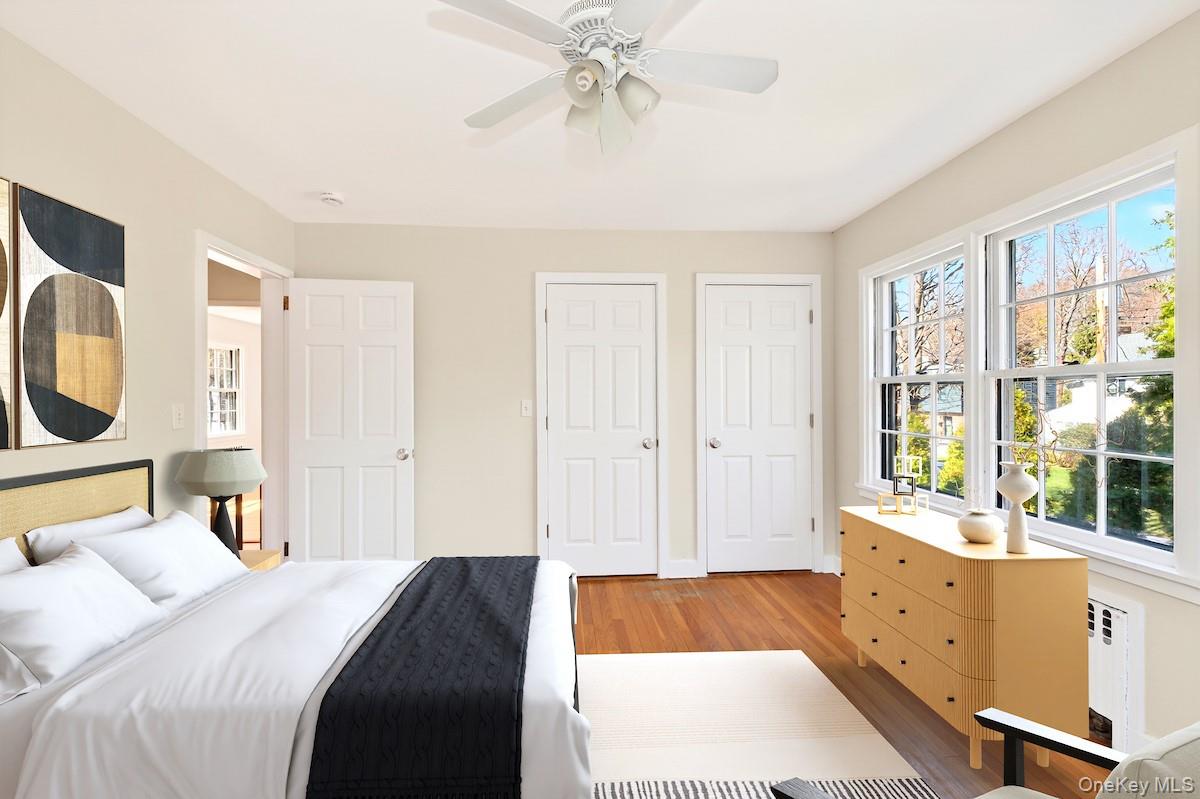48 Fenwick Road Hastings-on-Hudson, NY 10706 - Photo 26 of 40 a bedroom with a bed and a chandelier