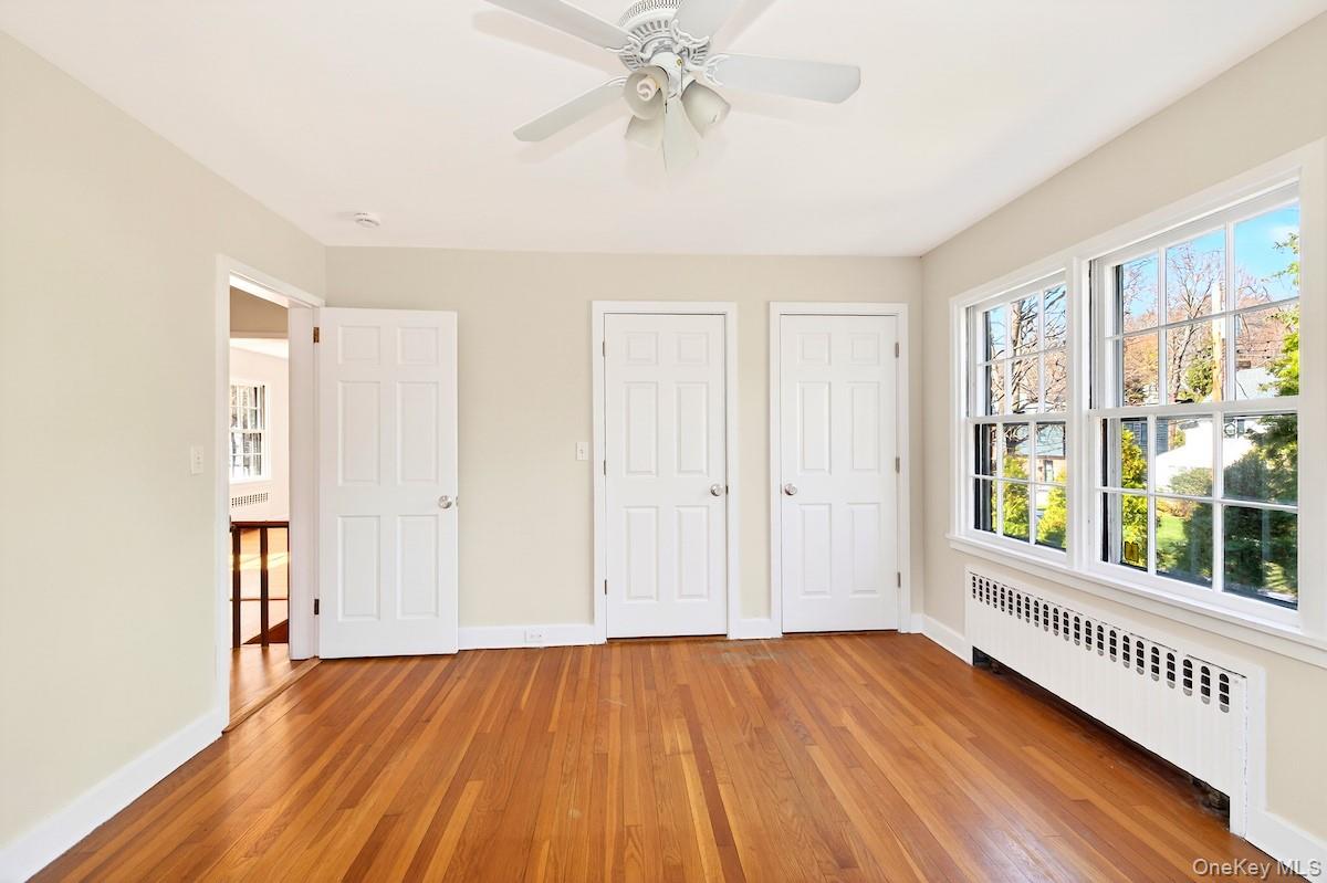 48 Fenwick Road Hastings-on-Hudson, NY 10706 - Photo 27 of 40 wooden floor in an empty room with a window