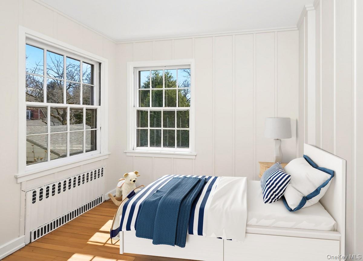 48 Fenwick Road Hastings-on-Hudson, NY 10706 - Photo 32 of 40 a bedroom with a bed and a window
