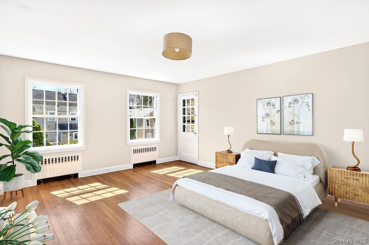 48 Fenwick Road Hastings-on-Hudson, NY 10706 - Photo 7 of 40 a bedroom with a bed and wooden floor
